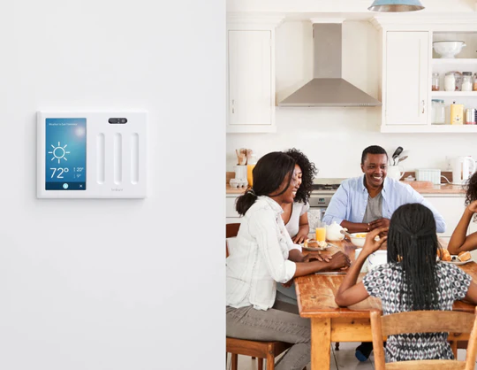 Family using Brilliant smart home touchscreen panel