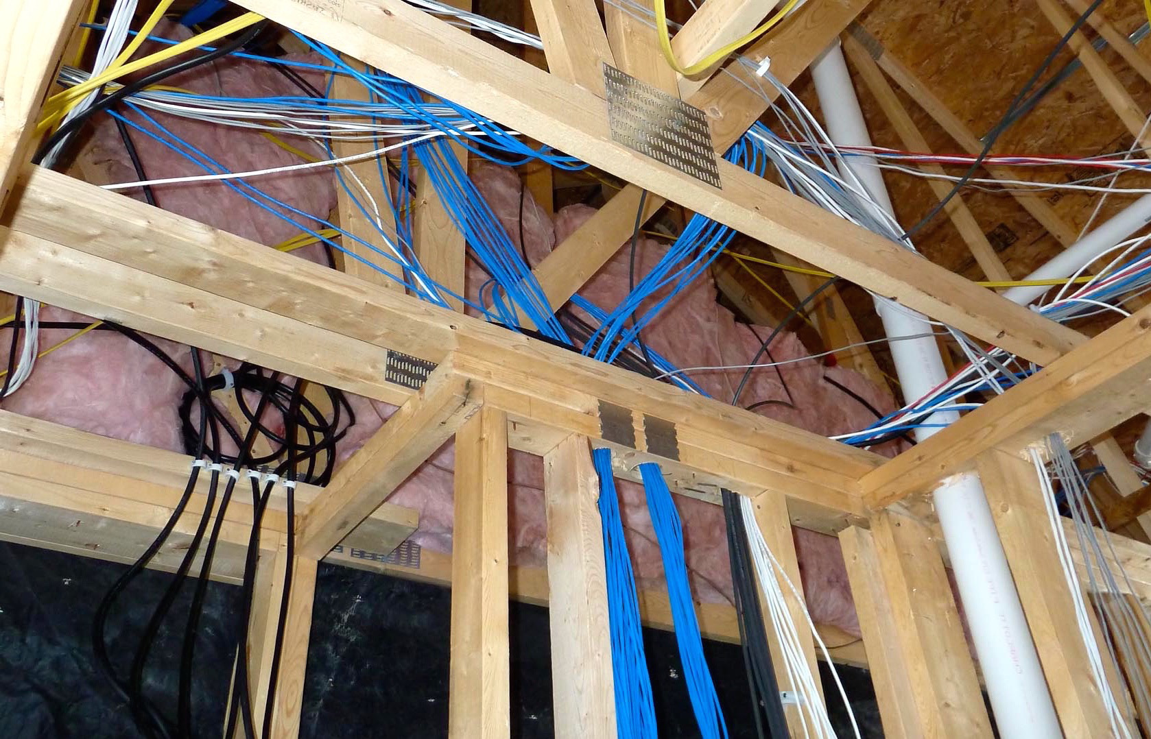 Bundled Cat6a, coax, and speaker runs pulled to a structured media location during pre-wire rough-in